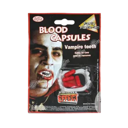 Vampire kit with dentures and fake blood capsules