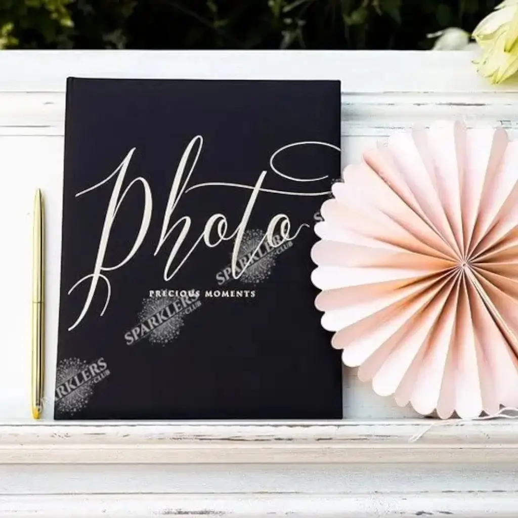 Black photo album with gold lettering
