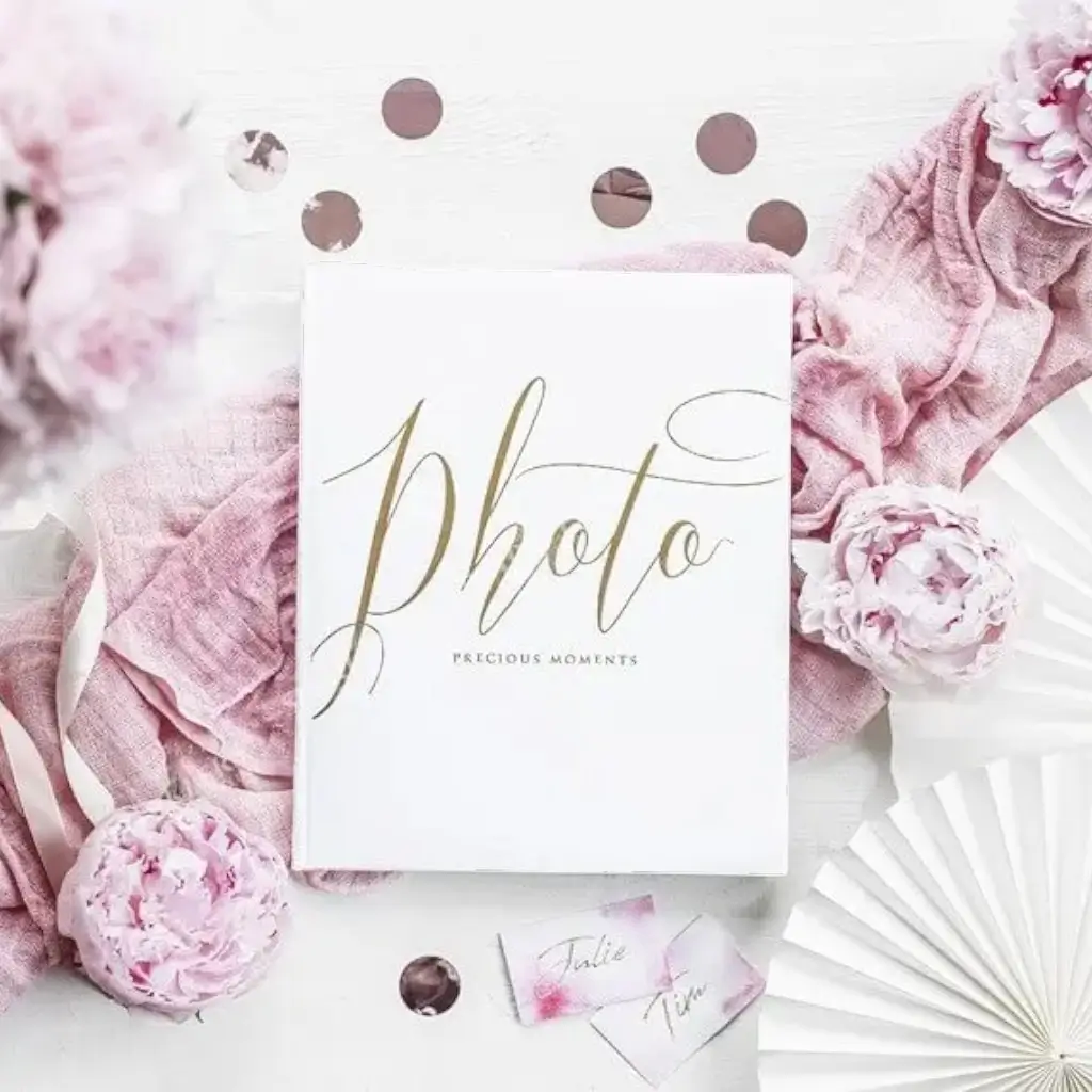 White photo album with gold lettering