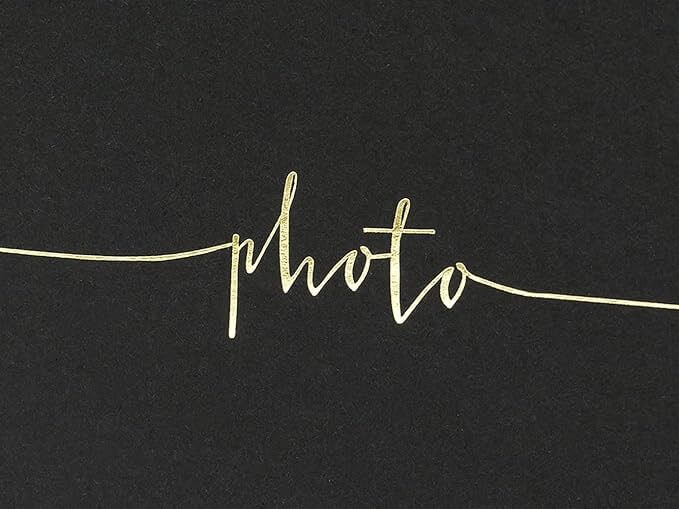 Black landscape photo album with gold lettering